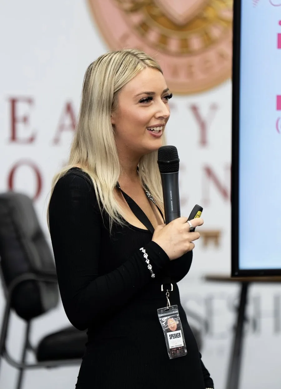 Cortney De Voe speaking on stage